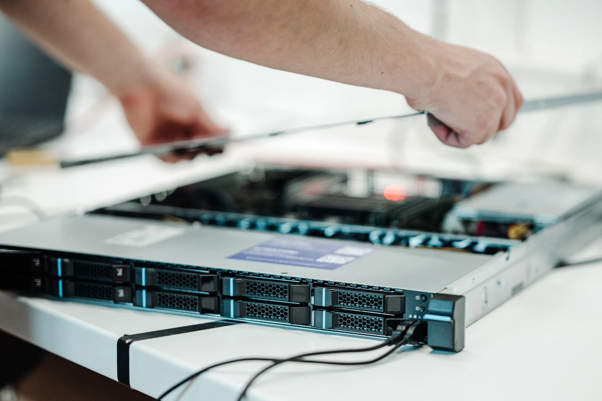 Technician mounting a server in the rack